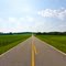 Nothing special here. Just not a common sight in "them there these parts"! A relatively straight road bordered by corn fields.
